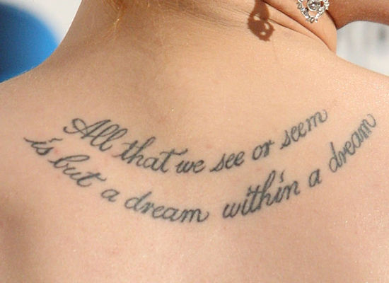 The tattoo between Evan Rachel Wood's shoulder blades is a quote by Edgar 