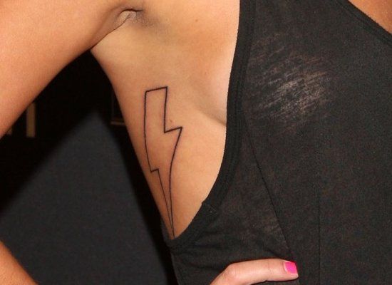  brand new lightning bolt tattoo out for show underneath her right arm.