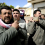 Syrian mourners carry the body of a man