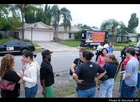 Bystanders and Reporters Outside Anthony House