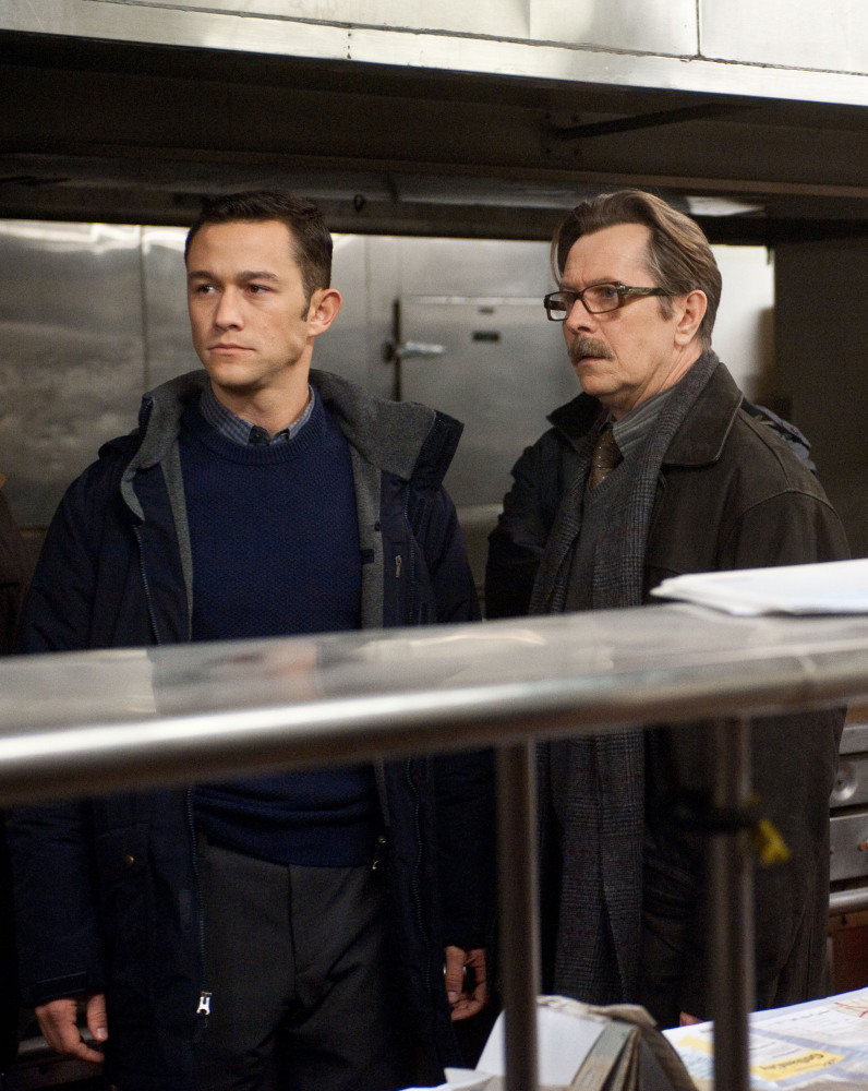 Joseph Gordon-Levitt as John Blake, left, and Gary Oldman as Commissioner Gordon in a scene from the action thriller "The Dark Knight Rises." (Photo credit: AP Photo/Warner Bros. Pictures, Ron Phillips)