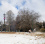 Two people play with snow in a park on A