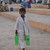A Pakistani child sells beverages on a b