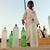 A Pakistani child sells beverages on a b