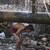  Indian man bathes under a leaking water supply pipeline on World Water Day on the outskirts of Jammu, India, Friday, March 22, 2013. The U.N. estimates that more than one in six people worldwide do not have access to 20-50 liters (5-13 gallons) of safe f