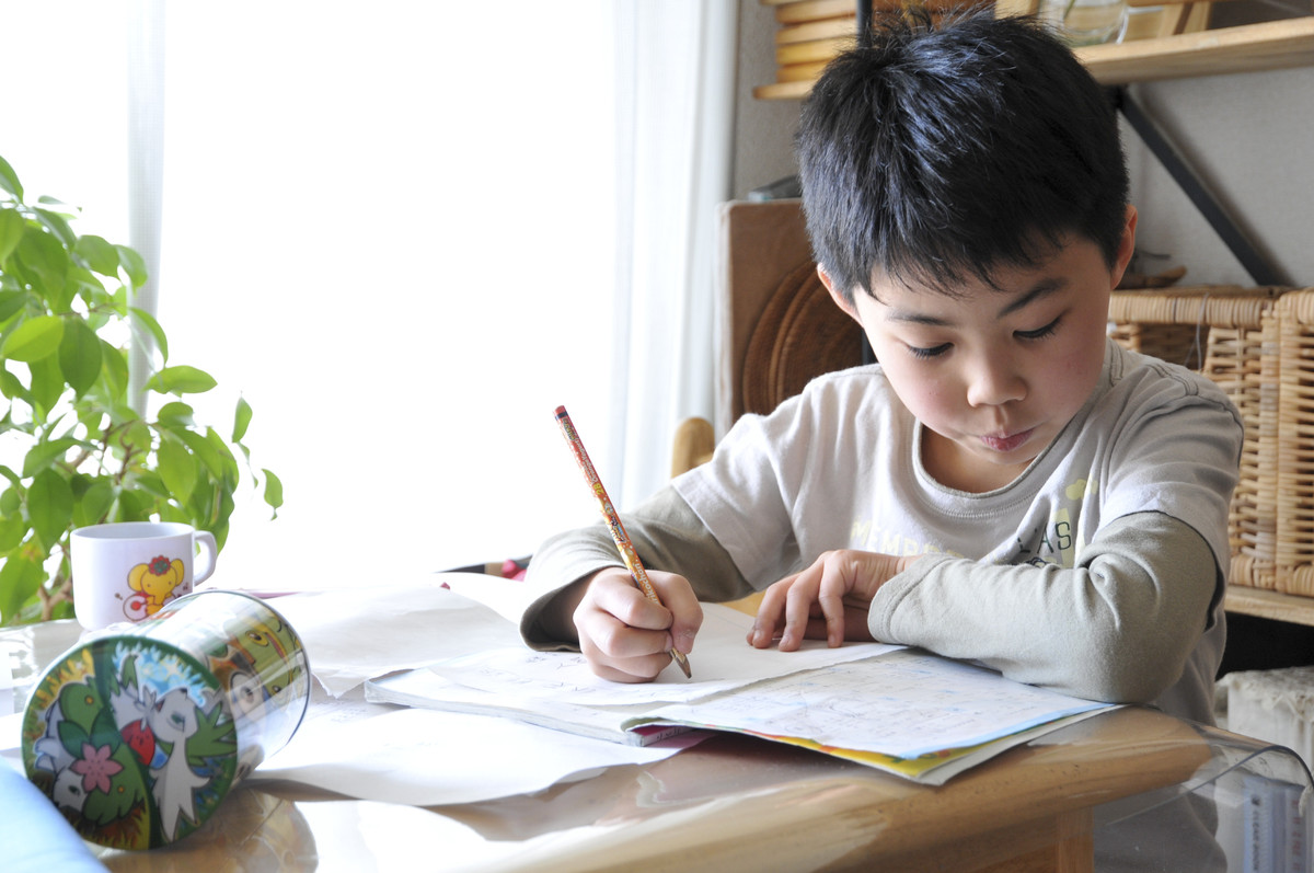 photo of child doing homework