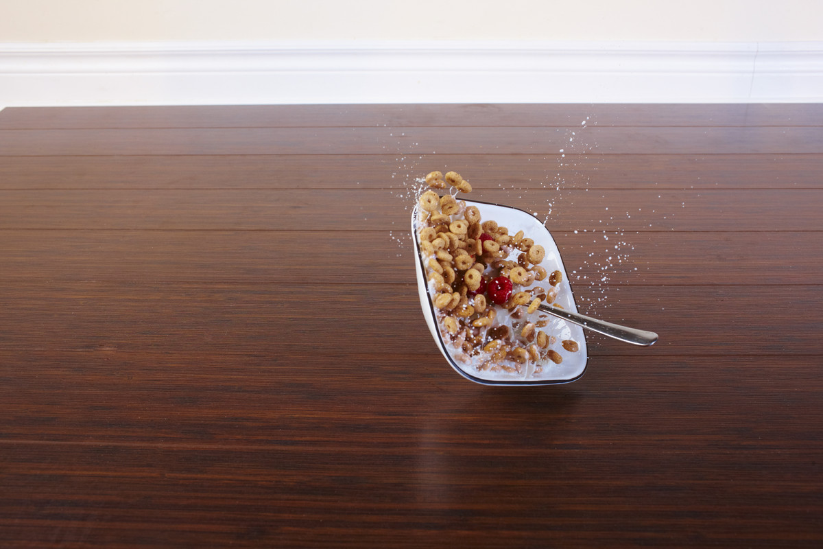 Bowl of cereal falling to the ground