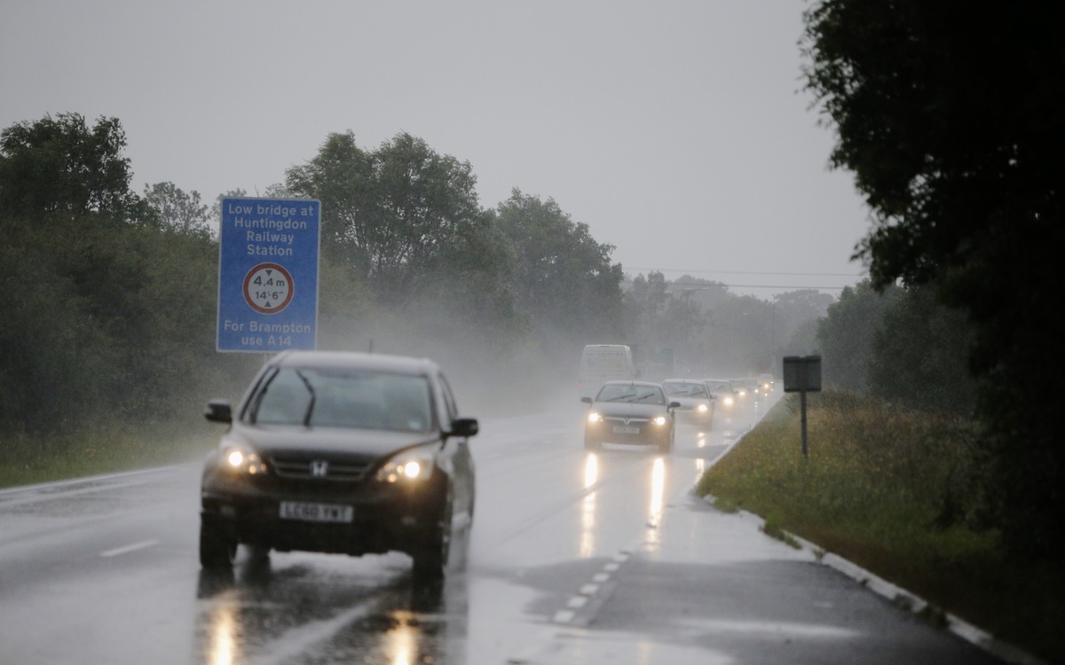 12 Underwhelming Images Of Cars Driving Through Puddles During
