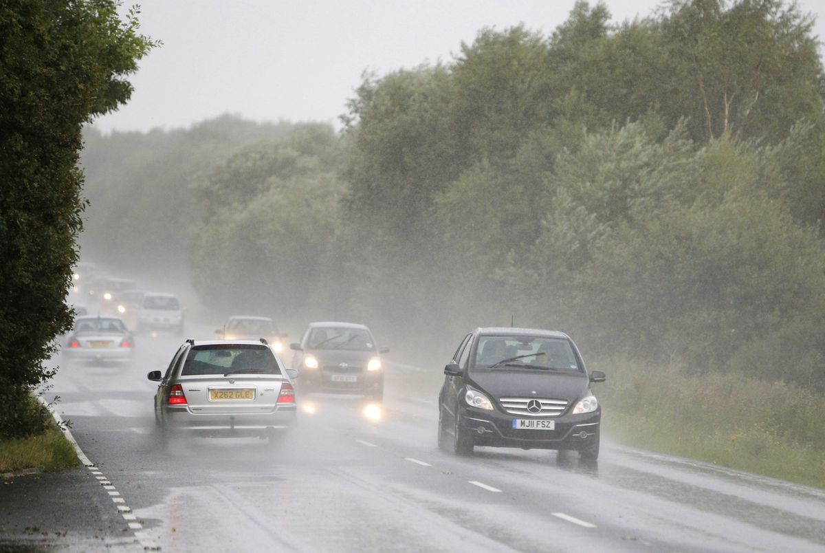 12 Underwhelming Images Of Cars Driving Through Puddles During