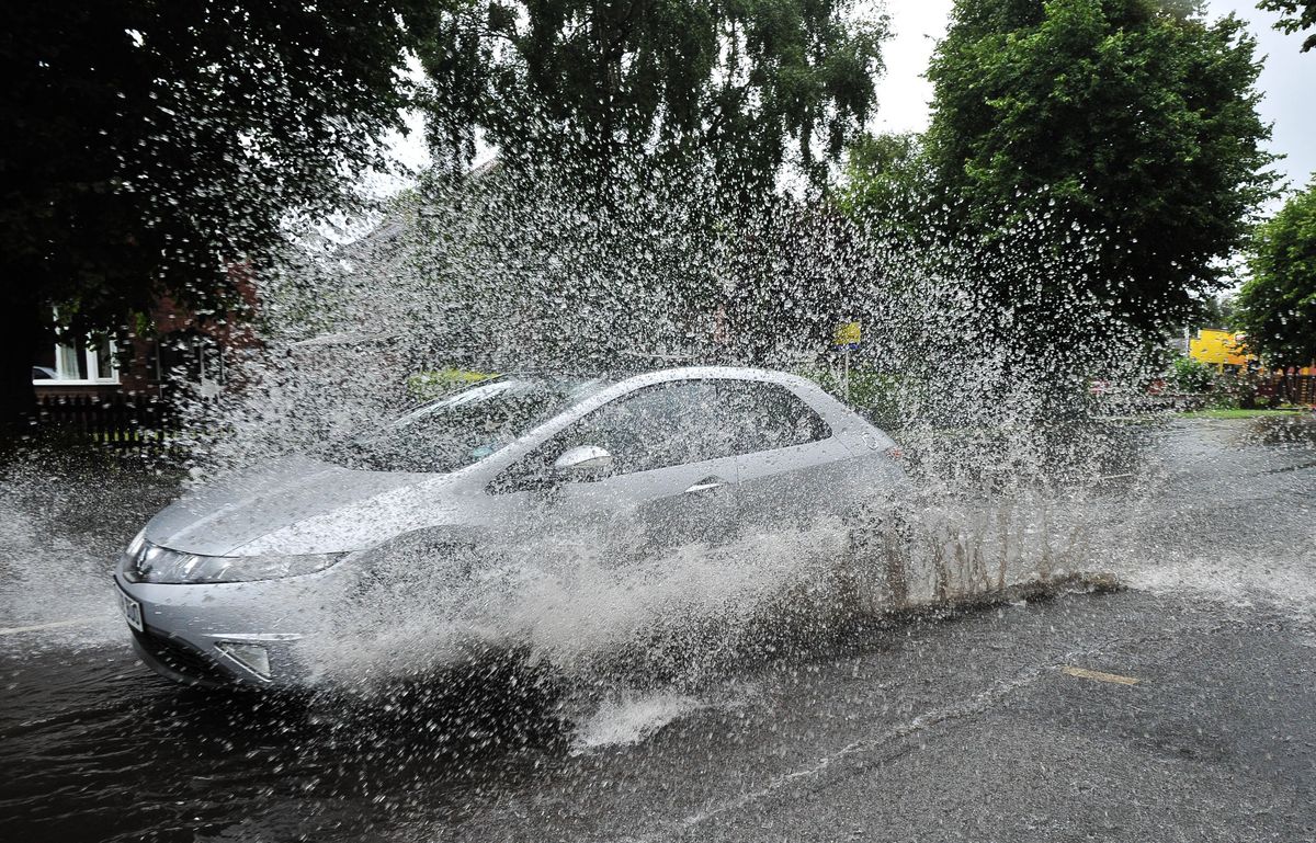 12 Underwhelming Images Of Cars Driving Through Puddles During