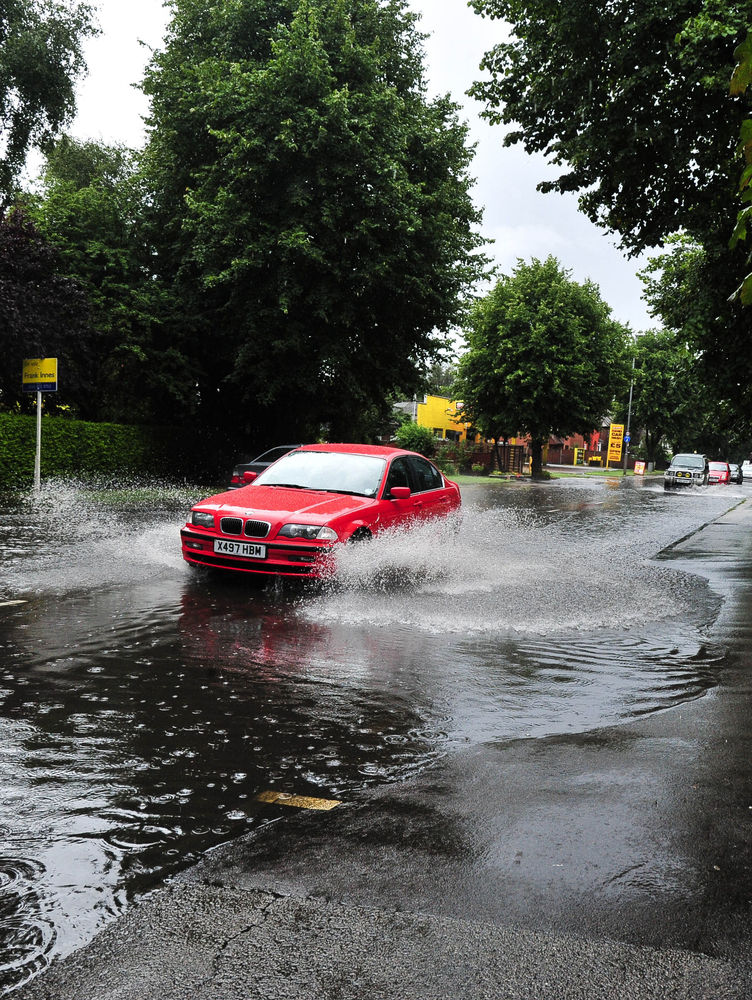 12 Underwhelming Images Of Cars Driving Through Puddles During