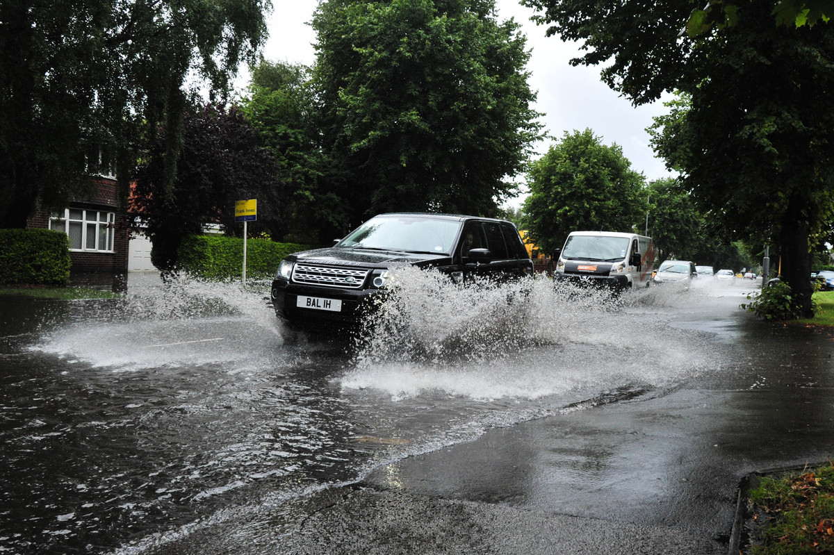 12 Underwhelming Images Of Cars Driving Through Puddles During