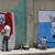 Graffiti artists draw the pictures of killed 14 Yemeni soldiers on the walls of Sanaa
