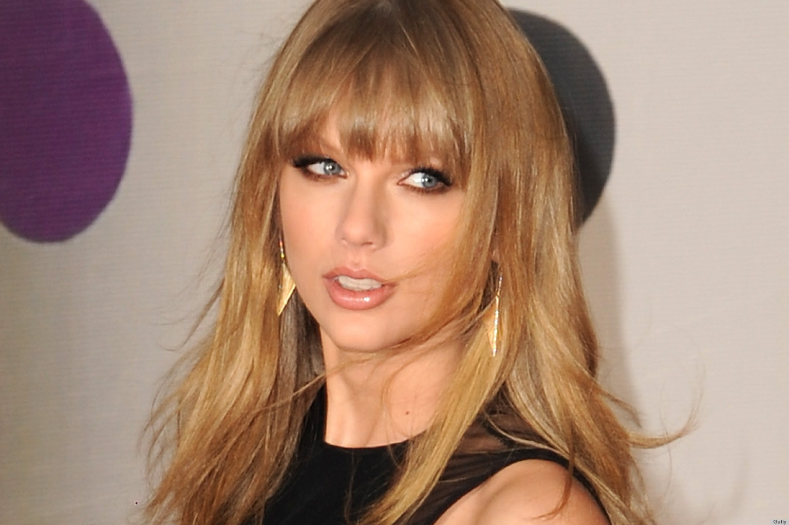Taylor Swift's Brit Awards Dress Is A Leggy Message To Harry Styles