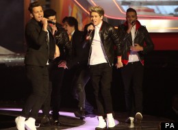 WATCH: One Direction Run Down Walkway At The BRITS