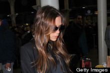 Victoria Beckham Arrives Back In London, Makes A Clutch Bag Look Practical