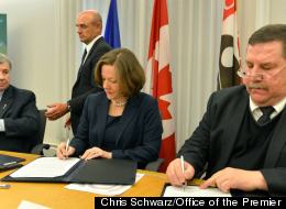 Redford Signs $85 Million Metis Funding Agreement