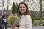 Kate Middleton Hides Baby Bump In White...