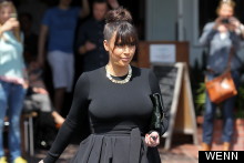 Kim Kardashian Hides Baby Bump Below Skater Skirt And Layers Of Attitude