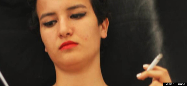 Topless Tunisian Activist Escapes Family