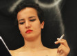 Topless Tunisian Activist Escapes Family