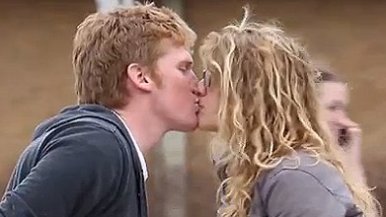 Man kissing woman