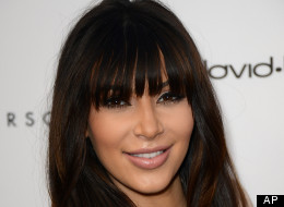 Kim Kardashian Settles Divorce