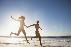 Couple on beach in suny weather