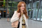 Jet-Setter: Isla Fisher Lands At...
