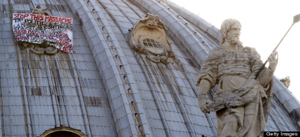 PHOTOS: Man Climbs On St Peter's Dome To Protest Italian Politics