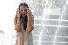 Katie Holmes Gets Soaked By...