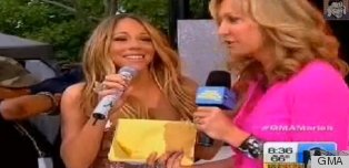 WATCH: Mariah Carey's Dress Pops Open On TV