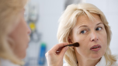 Older Woman Applying Makeup