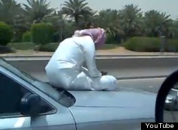 WATCH: Man Sits On Bonnet Of Moving Car, Texting
