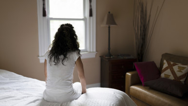 Woman Looking Out Window