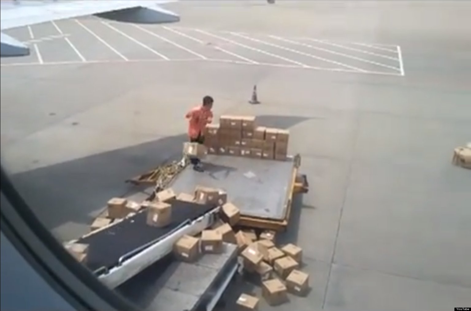 Chinese Air Freight Worker Throws Boxes Onto Plane In Style (VIDEO