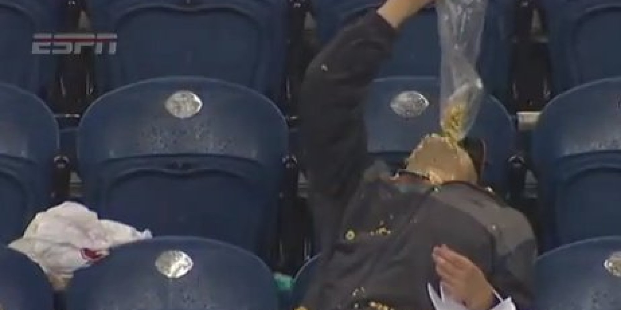 Washington State Fan Eats Popcorn In Rain During Cougars' Loss To