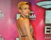 Miley Cyrus Turns Heads At The MTV EMAs In Plunging, Backless Dress