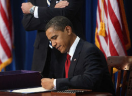 Obama+signing+health+care+bill