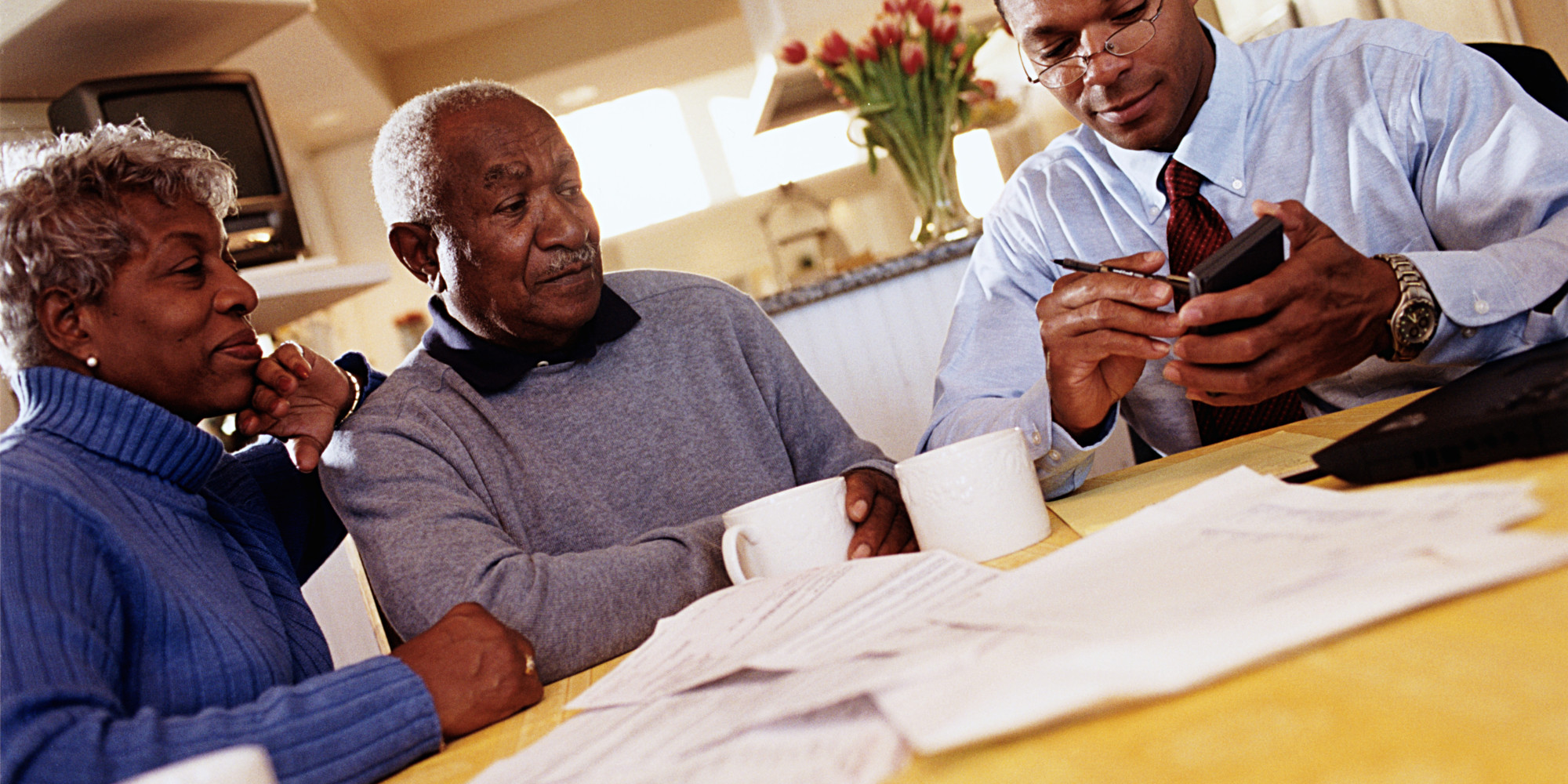 o-AFRICAN-AMERICAN-COUPLE-WITH-FINANCIAL-PLANNER-facebook.jpg