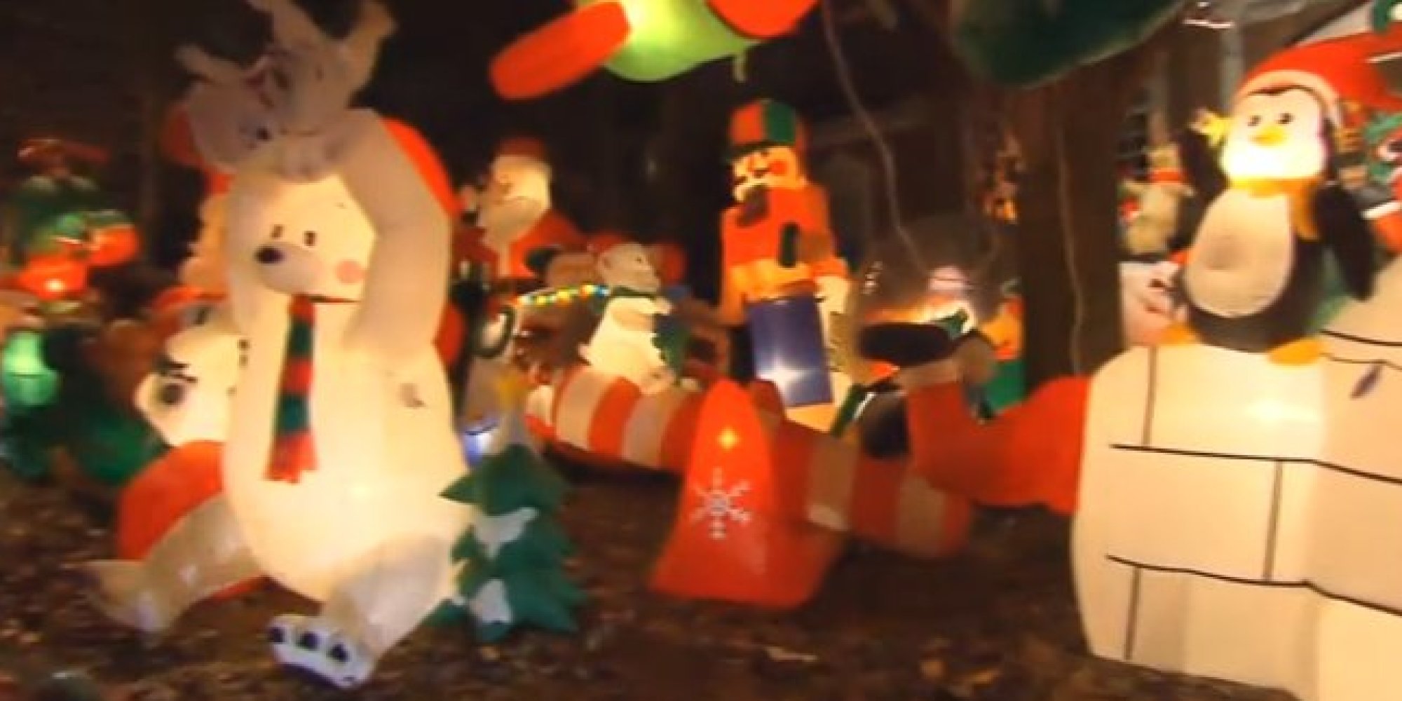 This Yard Decorated With Crazy Holiday Inflatables Is Garish For Good