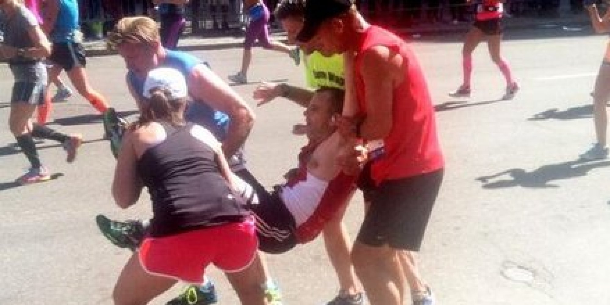 Photos Of Runner Being Carried Toward Finish Line Capture What Boston