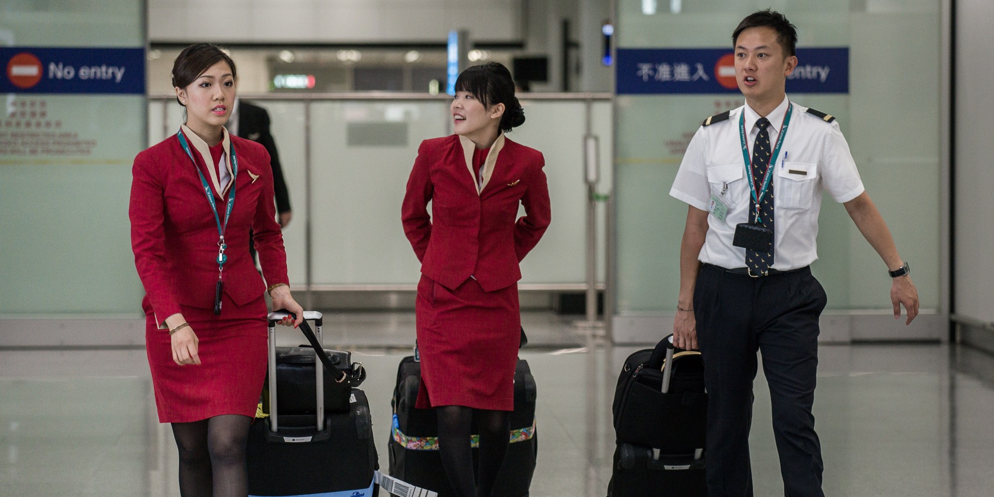 Cathay Pacific Flight Attendants Say Too Sexy Uniforms Are Fueling