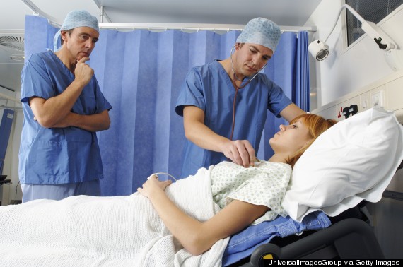 man and woman hospital gown