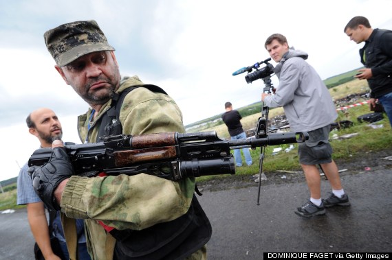 An armed pro-Russia militant attempts to stop journalists from accessing the site of the crash on July 19, 2014. (DOMINIQUE FAGET/AFP/Getty Images) An armed pro-Russia militant attempts to stop journalists from accessing the site of the crash on July 19, 2014. (DOMINIQUE FAGET/AFP/Getty Images)