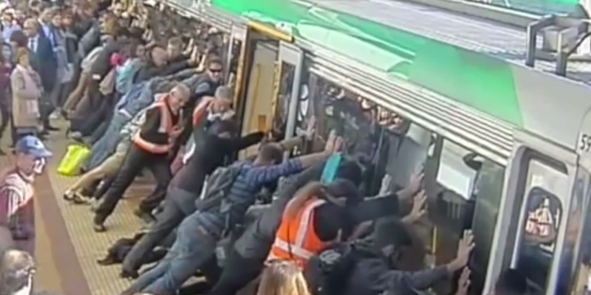 commuters-push-train-to-free-trapped-passenger-huffpost