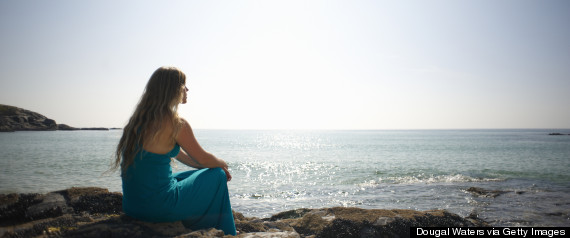 woman looking at ocean