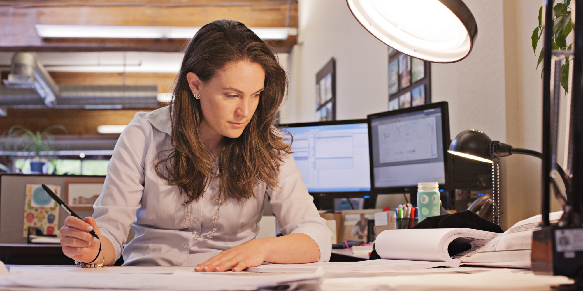 Image result for woman sitting at desk