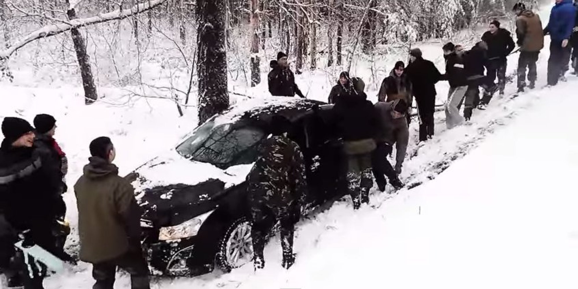 Russians Unite To Pull Car Out Of Snowy Ditch... And It's Not As Easy