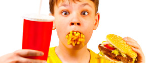 Boy Eating Cheeseburger
